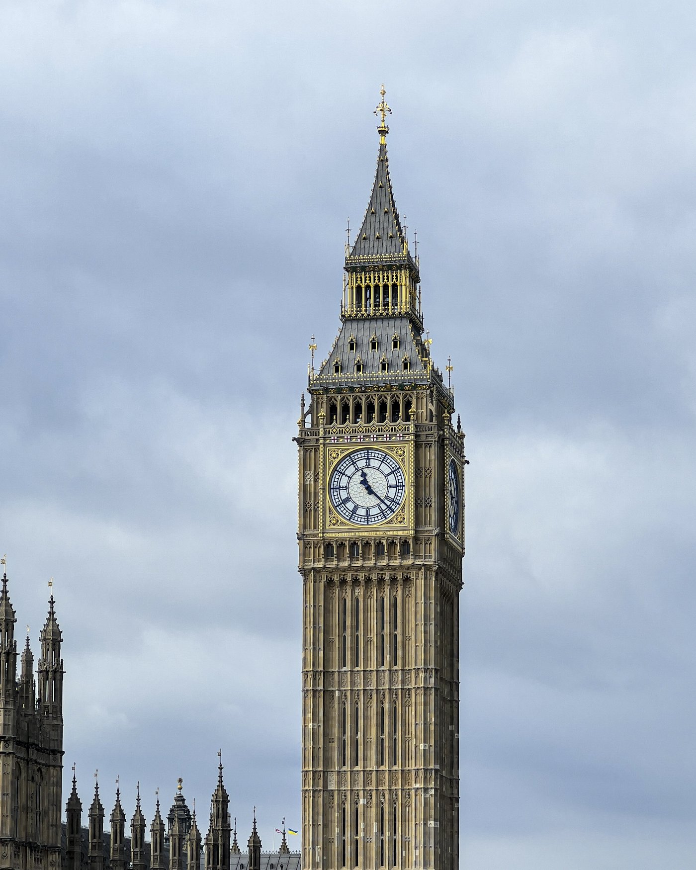 Big Ben and the Houses of Parliament in London under a cloudy sky